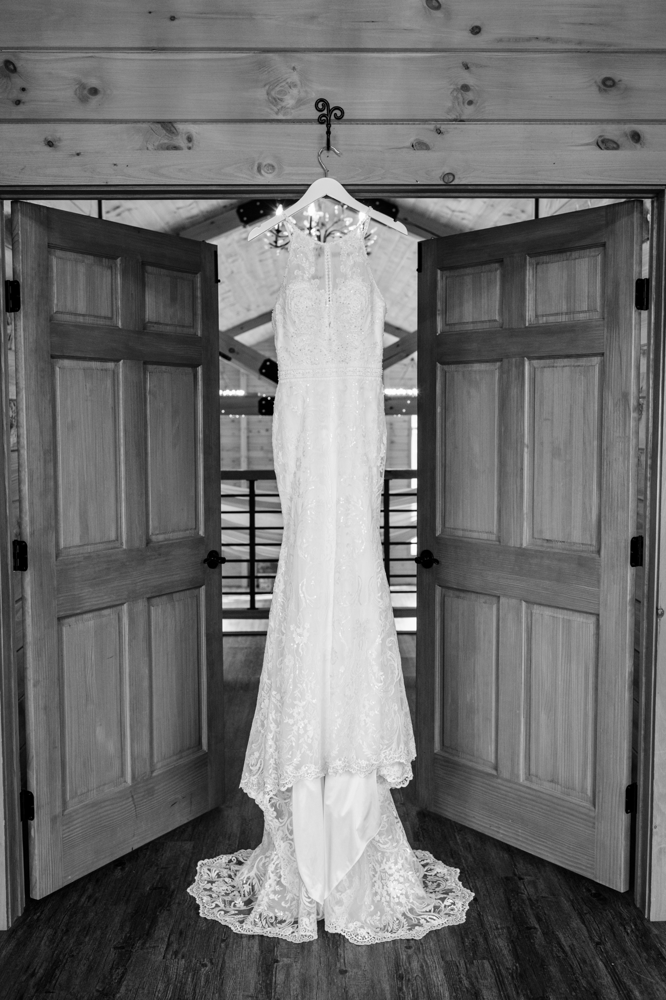 wedding dress hanging in a lodge